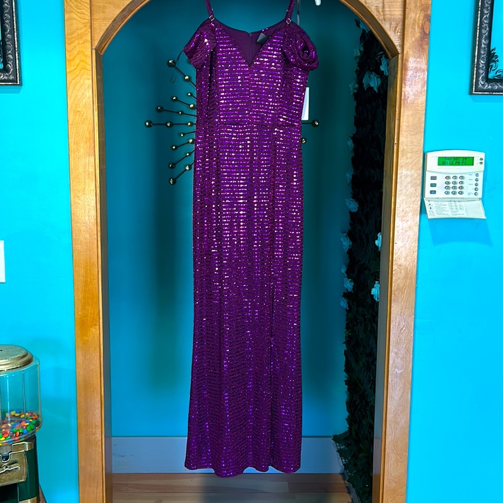 Beautiful sequence evening gown, purple eggplant in color new never been worn